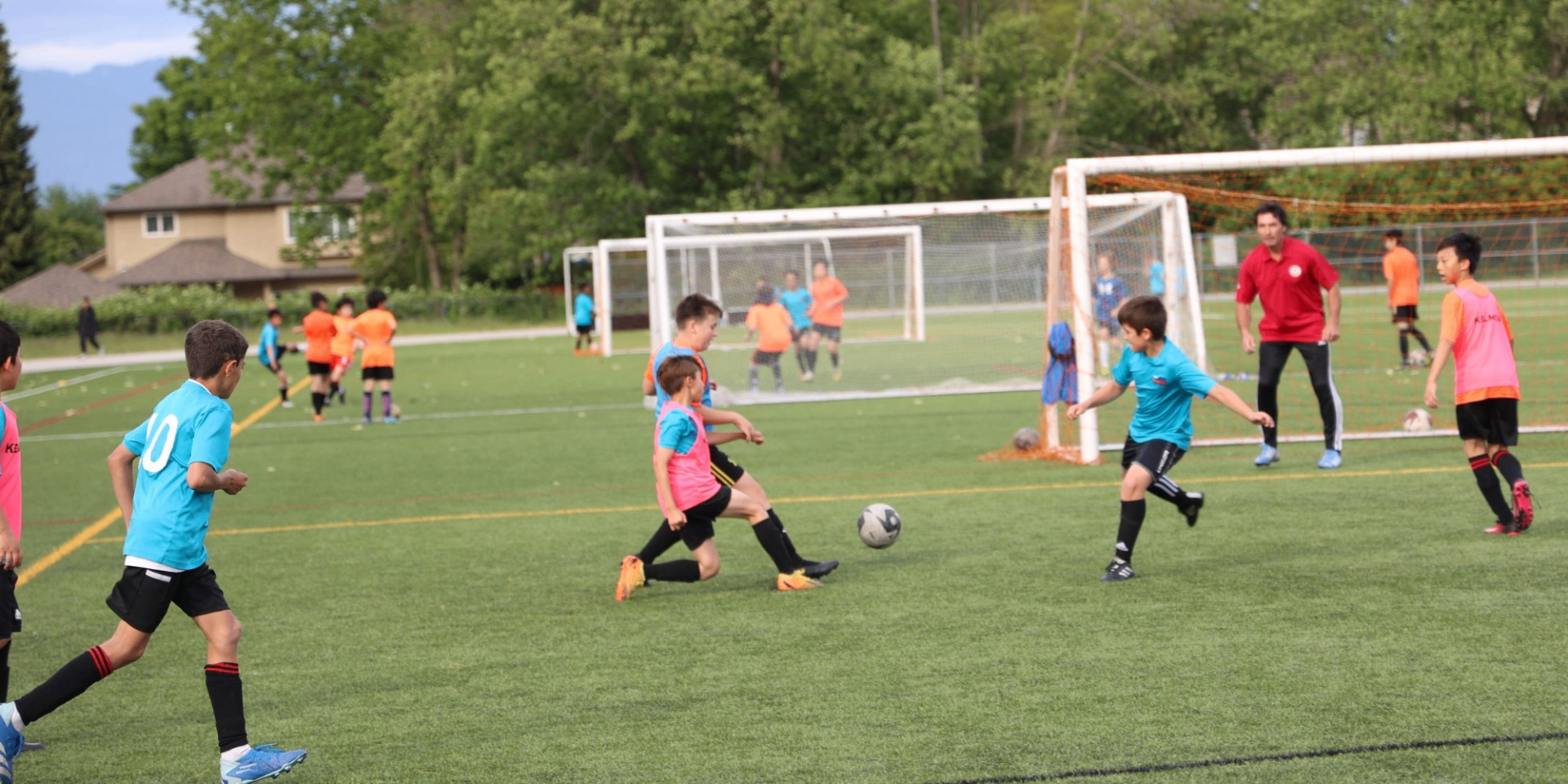 Kids playing soccer at Future Ballers Camp